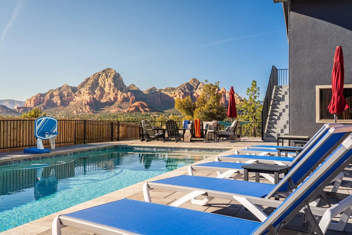 Relax and lounge by the pool with incredible Thunder Mountain red rock views. Crazy views from the pool deck and backyard.