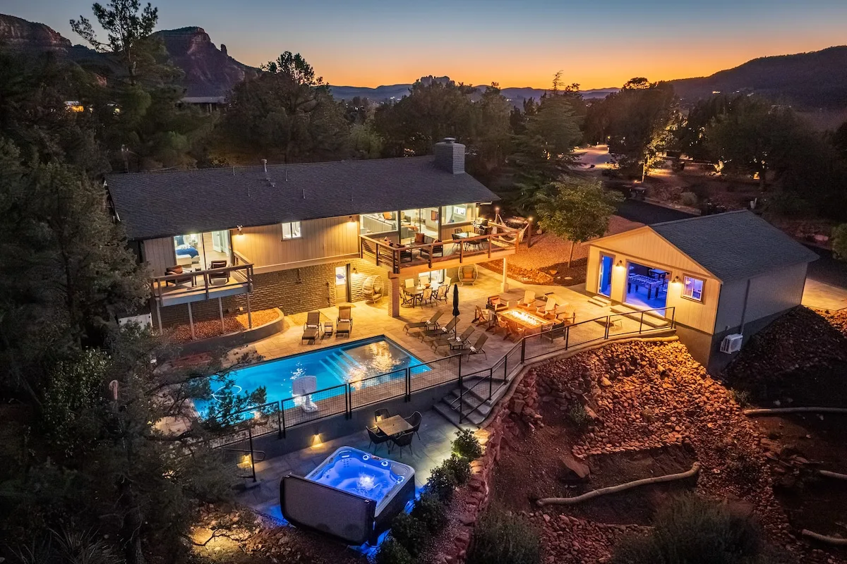 Wow, now this is a property. Viewing decks on top and bottom. Jumbo pool and Hot Tub. Huge firepit with seating. Gameroom in the garage on the right opens to the pool deck. Amazing views from all these lounging areas.