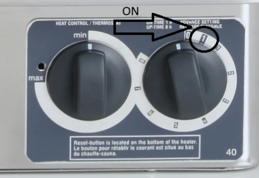 Sauna heater dials — left controls heat, right is the timer